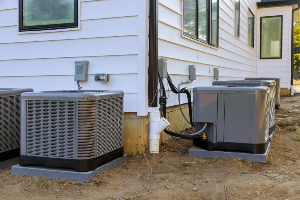 Air conditioning system unit installed outside facade of the new house