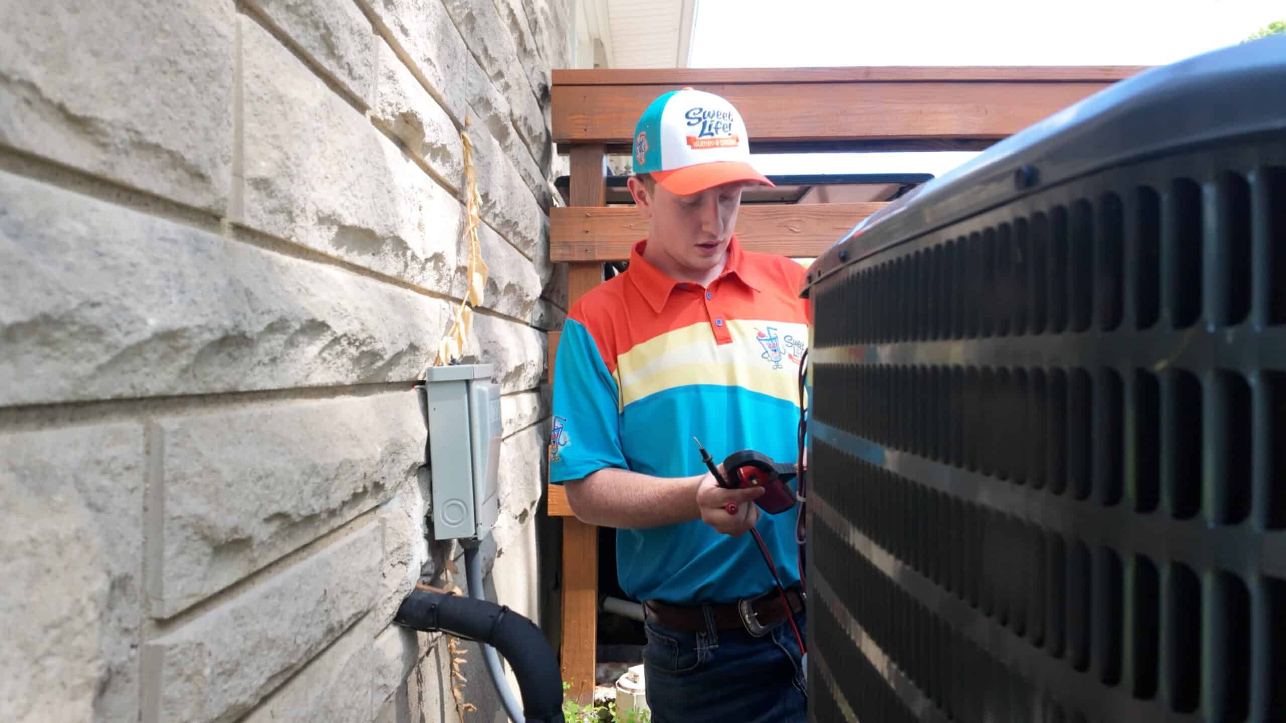 Sweet Life Heating, Cooling and Electric technician providing AC installation services.